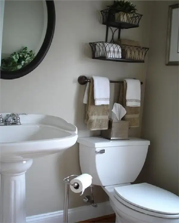 A modern bathroom with organized toiletries and soft towels.