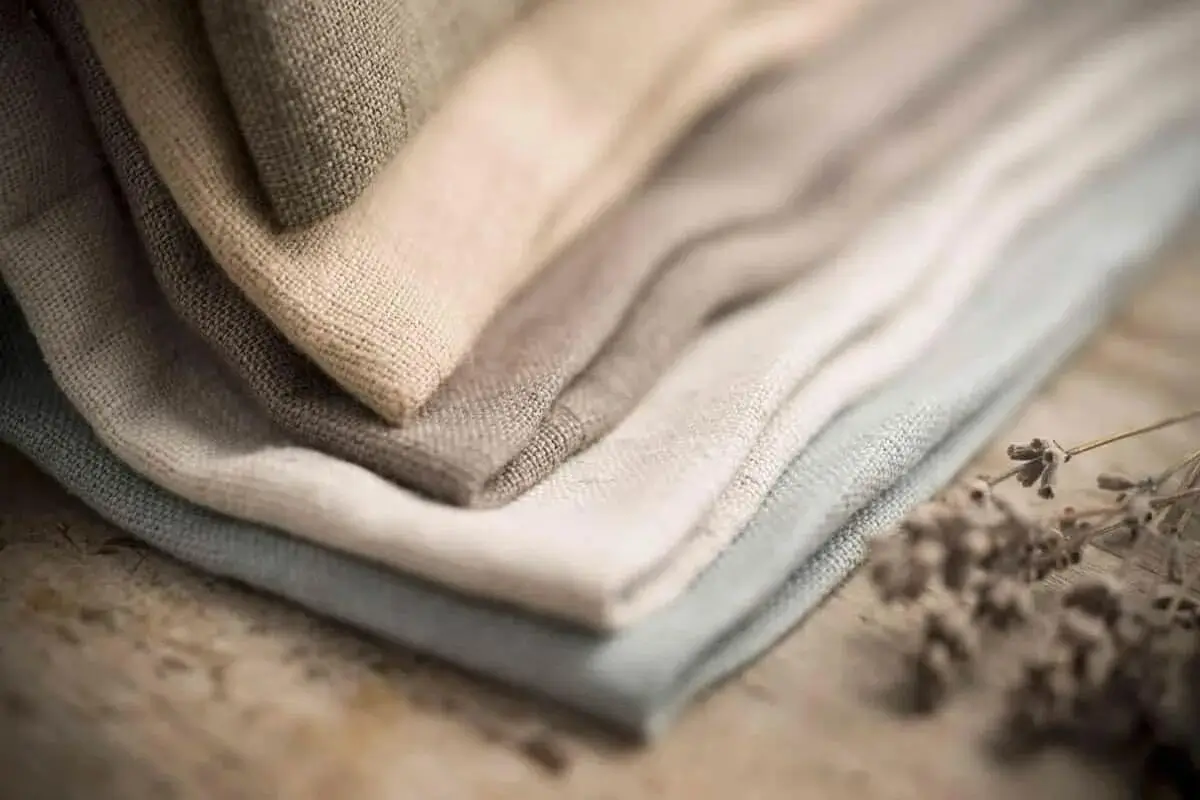 Soft, textured linen fabric folded neatly.