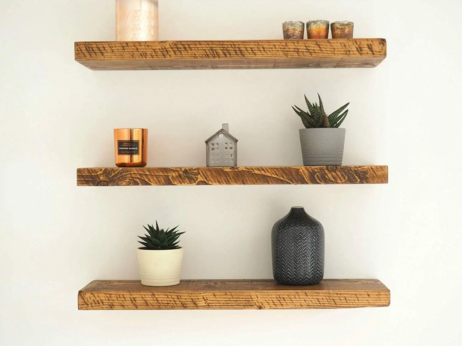 A curated shelf with personal decorative accents.